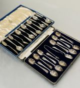 A case containing a set of twelve engraved tea spoons and pair of tongs with initial B and a set