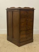 An early 20th century mahogany sheet music cabinet, with a galleried top above eight drawers with