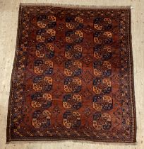 An Afghan Bokhara rug, first half of the 20th century, the red field with geometric motifs