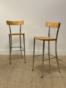 A pair of vintage chrome and beech bar stools. H102cm.