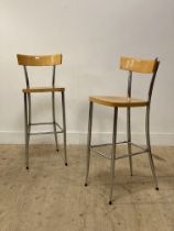 A pair of vintage chrome and beech bar stools. H102cm.