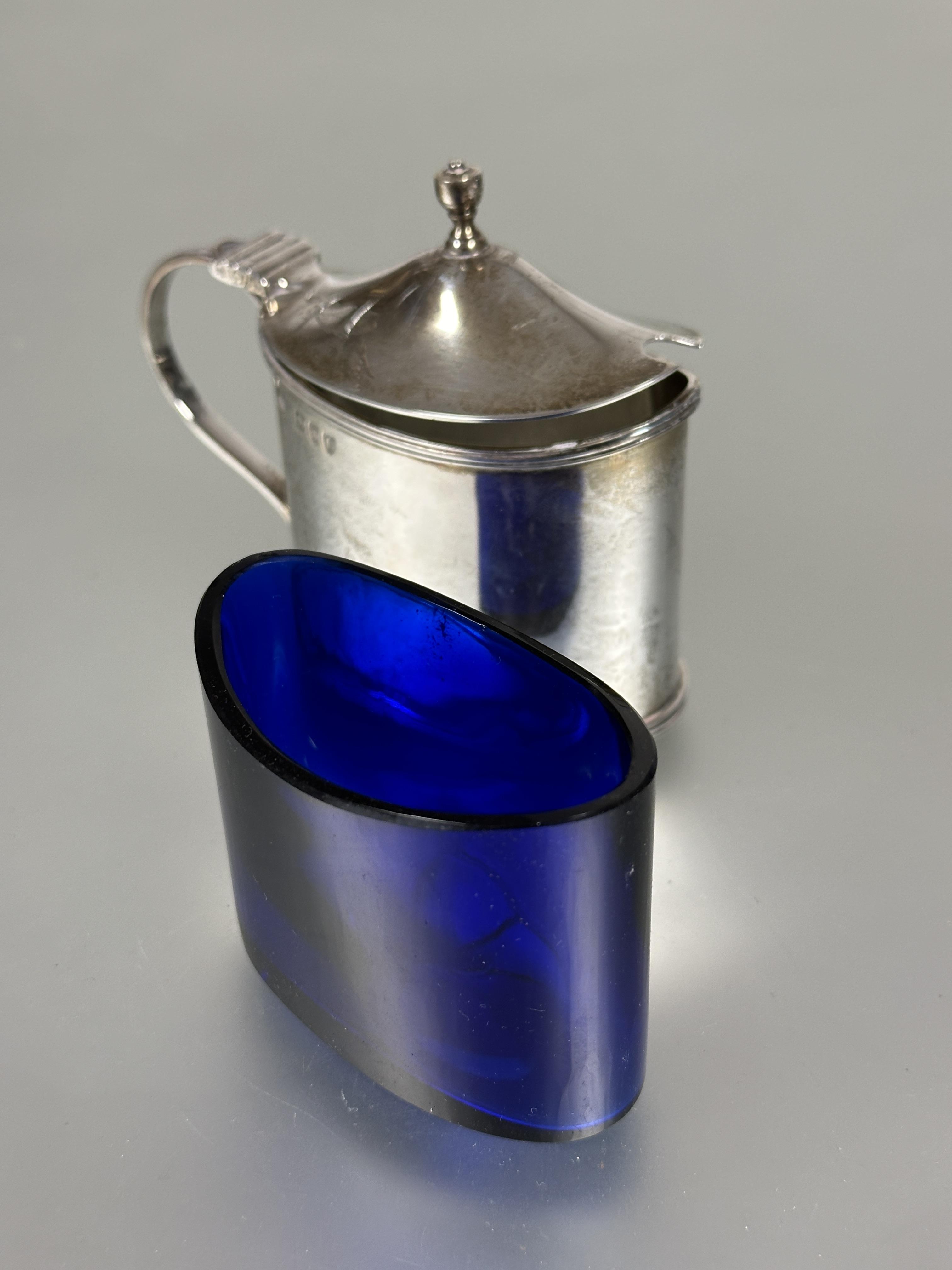 A Victorian London silver oval drum mustard with original blue glass liner and S scroll handle to - Image 3 of 5