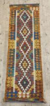 A Chobi kilim runner rug of geometric design 204cm x 65cm