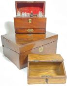 A group of antique wooden boxes comprising a mahogany writing slope (h- 14cm, w- 30cm, a/f), an