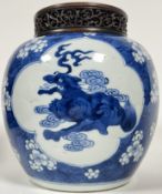 A Kangxi period Chinese blue and white porcelain jar decorated with three quatrefoil panels