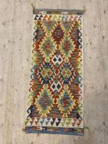 A Chobi kilim runner rug 154cm x 66cm.