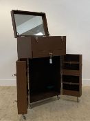 A contemporary leather bound steamer type vanity / bedroom cabinet, the hinged top opening to a