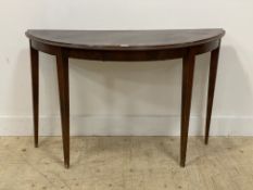 A 19th century mahogany demi-lune console table, raised on square tapered supports. H78cm, W125cm,