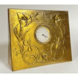 A Jugendstil H.A.C brass repousse decorated clock (h- 19cm, w- 22cm)