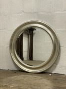 A contemporary silvered composition wall hanging mirror with bevelled plate. D73cm.