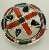 A Victorian Scottish style circular pebble set brooch with engraved border with original pin verso