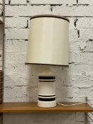A 1970's cream and brown banded ceramic lamp and shade