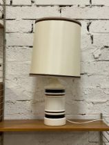 A 1970's cream and brown banded ceramic lamp and shade