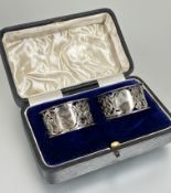 A pair of Edwardian Birmingham silver pierced and engraved floral napkin rings H x 2.5 cm D x 5cm in