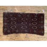 A large Turkmen Tekke bag face rug or wall hanging, late 19th century, the field, of dark red,
