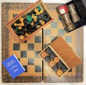 An embossed leather folding chess and backgammon board (37cm x 36cm) together with a group of