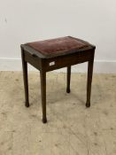 An Edwardian mahogany piano stool with upholstered hinged seat raised on square tapered supports