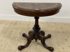 A Victorian walnut demi-lune card table, the fold over top inlaid with Greek key pattern border