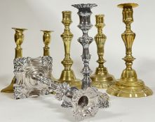 A group of candlestick holders including five brass, and a pair of silver plated (largest h- 25.5cm)