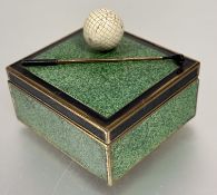Golfing interest, a brass box with green enamel grass panels to top and sides mounted with golf ball
