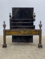 An early 19th century wrought iron, steel, and brass fire grate in the Neoclassical taste, with