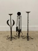A wrought metal three piece fire side companion set with rose and thistle motif (H56cm), together