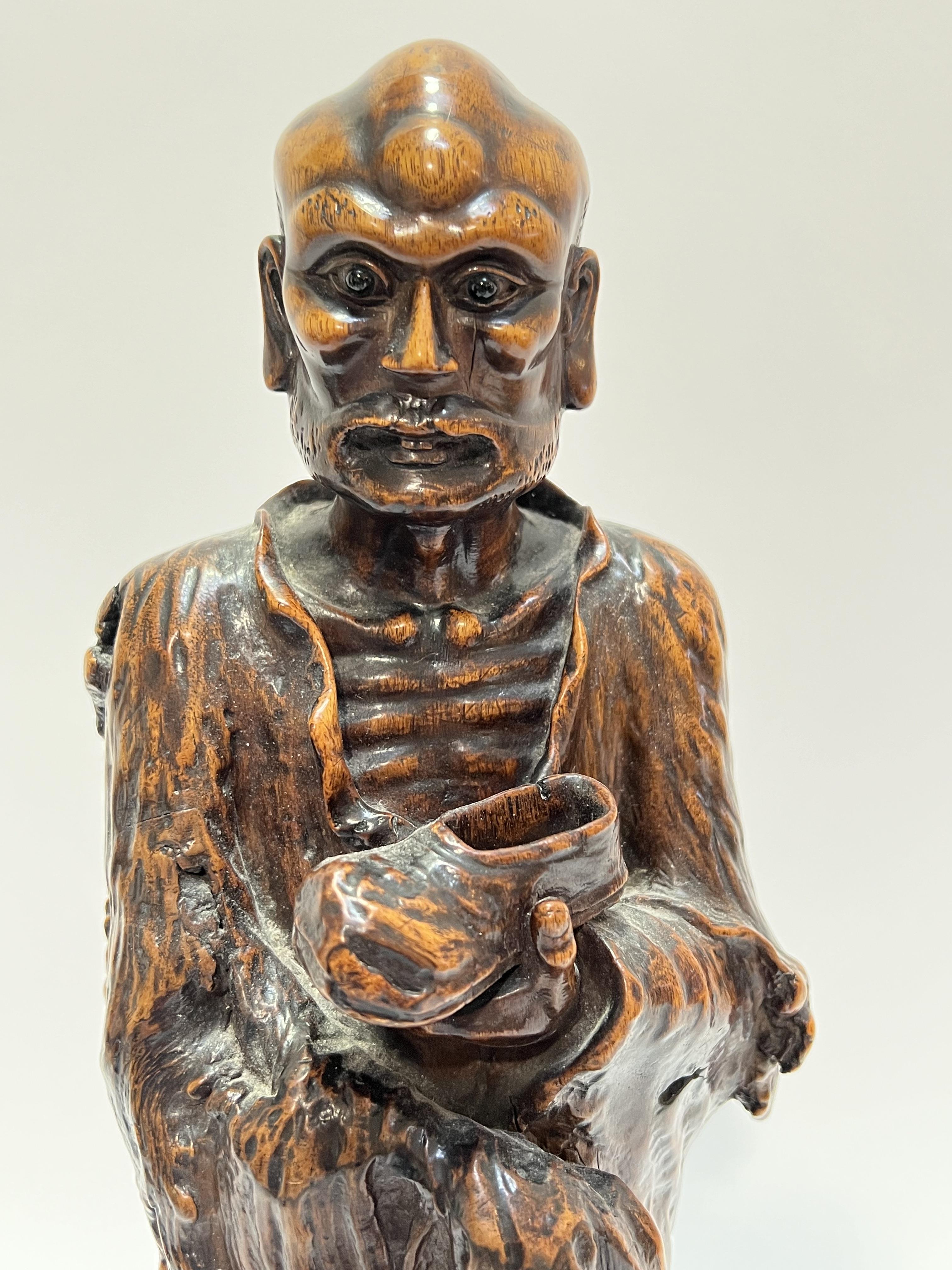 A good Chinese root carving of a monk/lohan on a turned wood base (h- 42cm) - Image 2 of 3