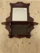 A Edwardian mahogany wall mirror with bevelled plate and fitted two open shelves. 80cm x 70cm.