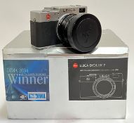 A boxed Leica Digilux 2 camera complete with accessories, lens cap and manuals etc...