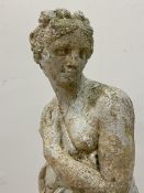 A weathered reconstituted stone garden statue modelled as Pandora. H81cm.