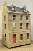 A large Dolls house, modelled after an Edinburgh New Town house (moving on castors.) H167cm, W105cm,