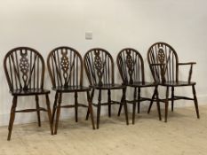 A set of five (4+1) stained beech Windsor type hoop, spindle and splat back dining chairs, with