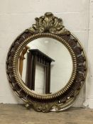 A large floral moulded composition wall hanging mirror with scrolled acanthus pediment. H130cm .
