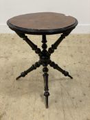An Aesthetic movement walnut, parcel gilt and ebonised gipsy table, the circular top raised on three