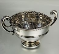 A Edwardian London silver twin C scroll handle rose bowl with plain border raised on circular