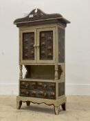 A miniature painted hardwood side cabinet, with arched cornice above two panelled doors and three