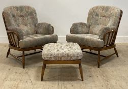 Ercol, a pair of Vintage stained beech framed lounge chairs, with hoop and spindle back above