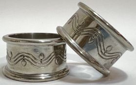 A pair of early twentieth century Liberty and Co English Pewter (design no. 08243) napkin rings (