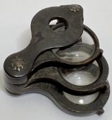 A jeweller's loupe/eye glass with three magnifications (wooden or horn)