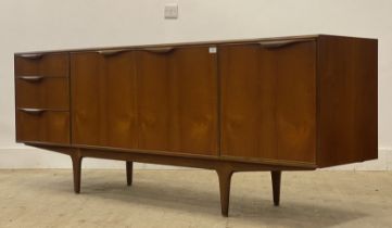 McIntosh of Kircaldy, a mid century teak sideboard, fitted to the centre with two doors enclosing
