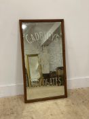 An early 20th century Cadburys etched glass advertising mirror in an oak frame with paper label