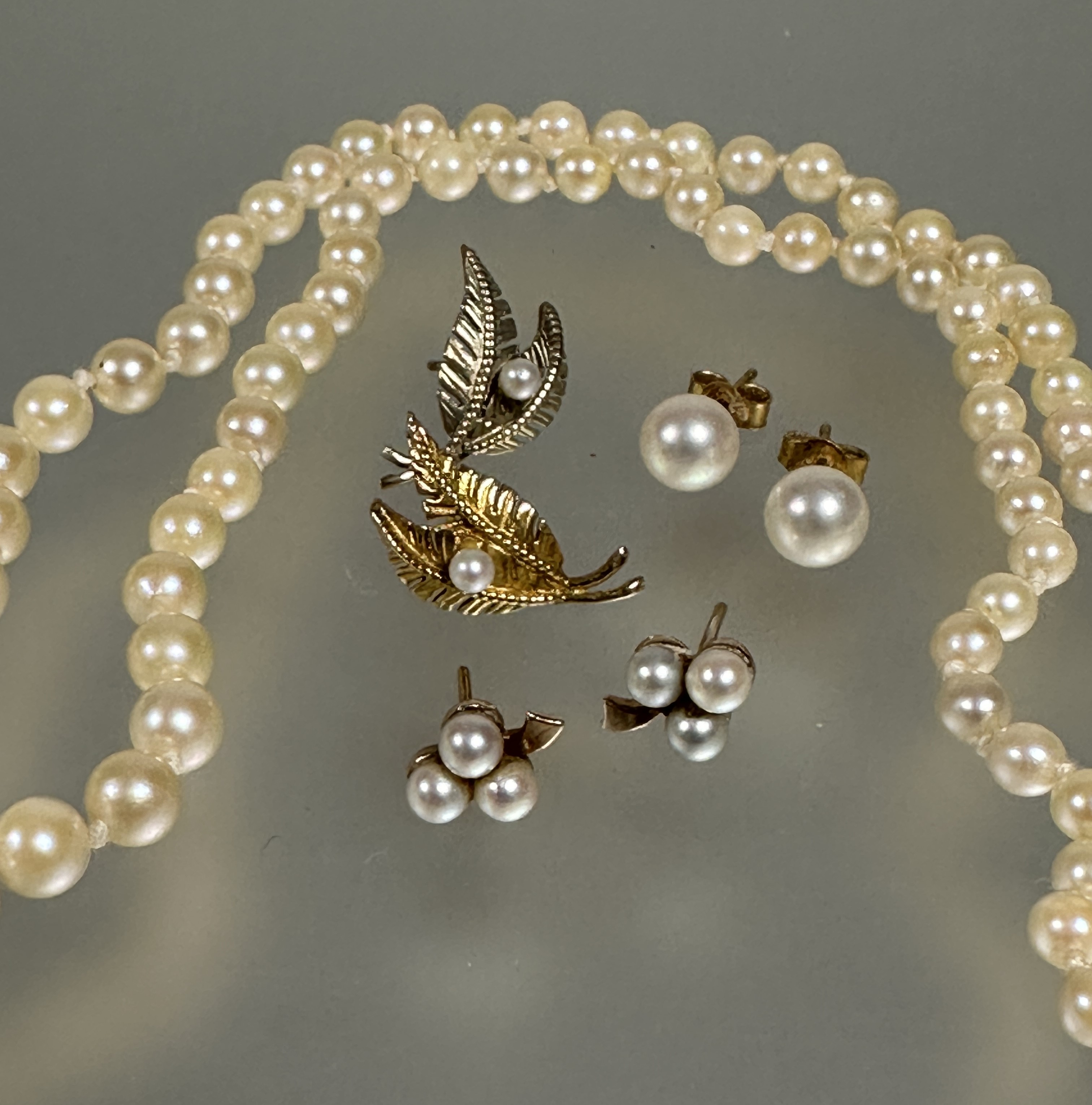 A graduated cultured pearl necklace with silver paste set clasp fastening one stone missing L x 26cm - Image 2 of 2