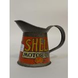 An early 20th century Shell Motor Oil 1 pint jug, painted all round. H13cm.