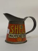 An early 20th century Shell Motor Oil 1 pint jug, painted all round. H13cm.