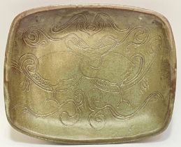 A studio pottery press moulded/hand-built dish with green glaze and incised decoration depicting
