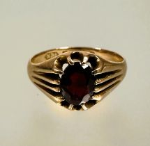 A 9ct gold garnet set dress ring in twelve claw fluted setting, stone included S 3.83g