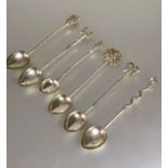 A set of six eastern white metal tea spoons each with different terminal including a palm tree,