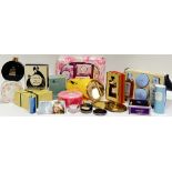 A group of cosmetics products including dusting powder, perfume, soaps, three compacts etc...(