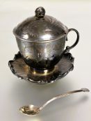 A 20thc Chinese white metal cup, cover and spoon standing on a water Lilly stand the cover engraved