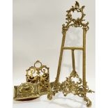 A Rococo style brass easel stand (h- 54cm, w- 28cm), together with a pierced brass letter rack and a